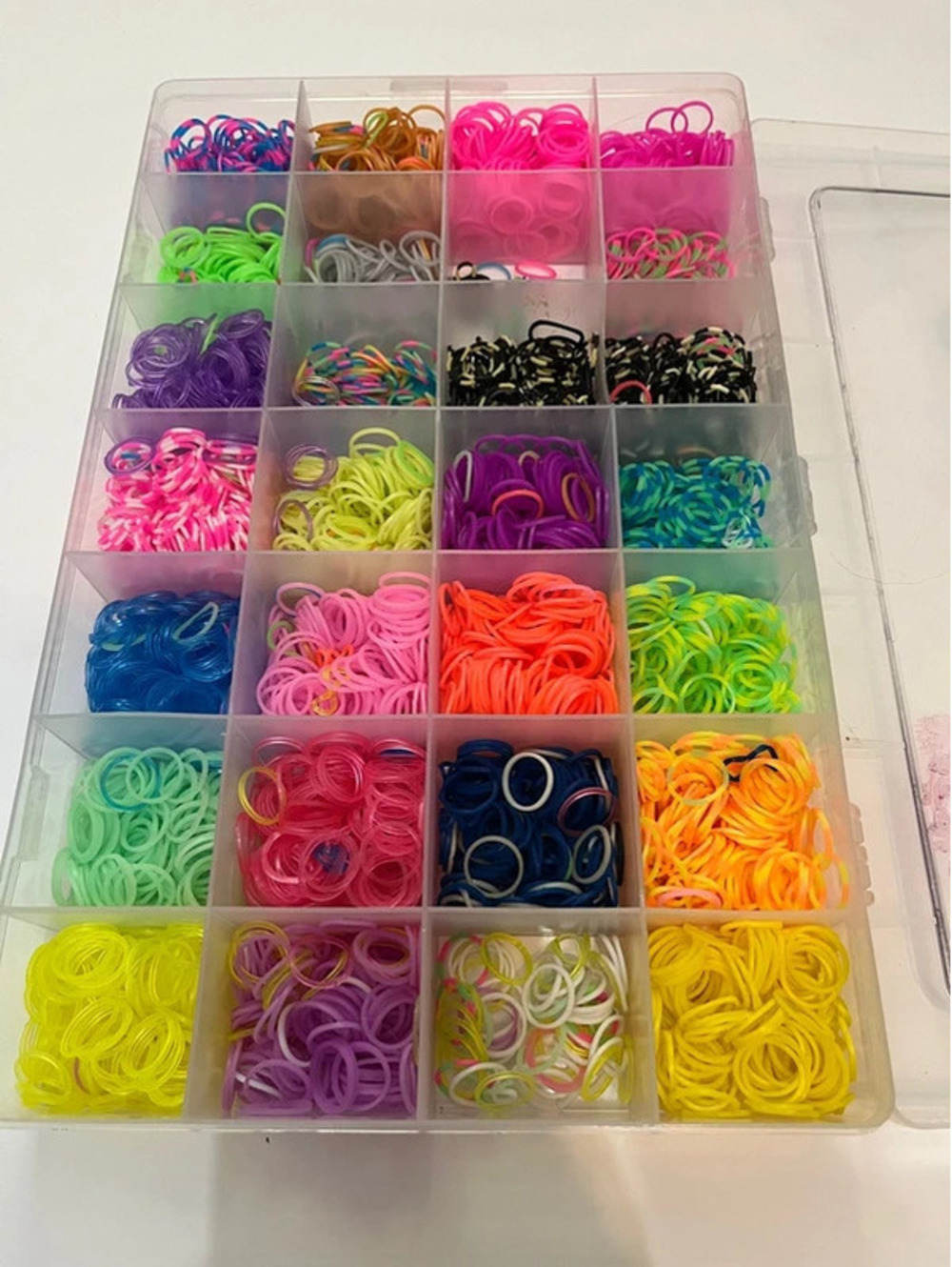 Plastic organizer box with colored rubber bands for bracelets
